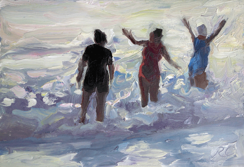 three women and a wave on Sennen beach Cornwall 